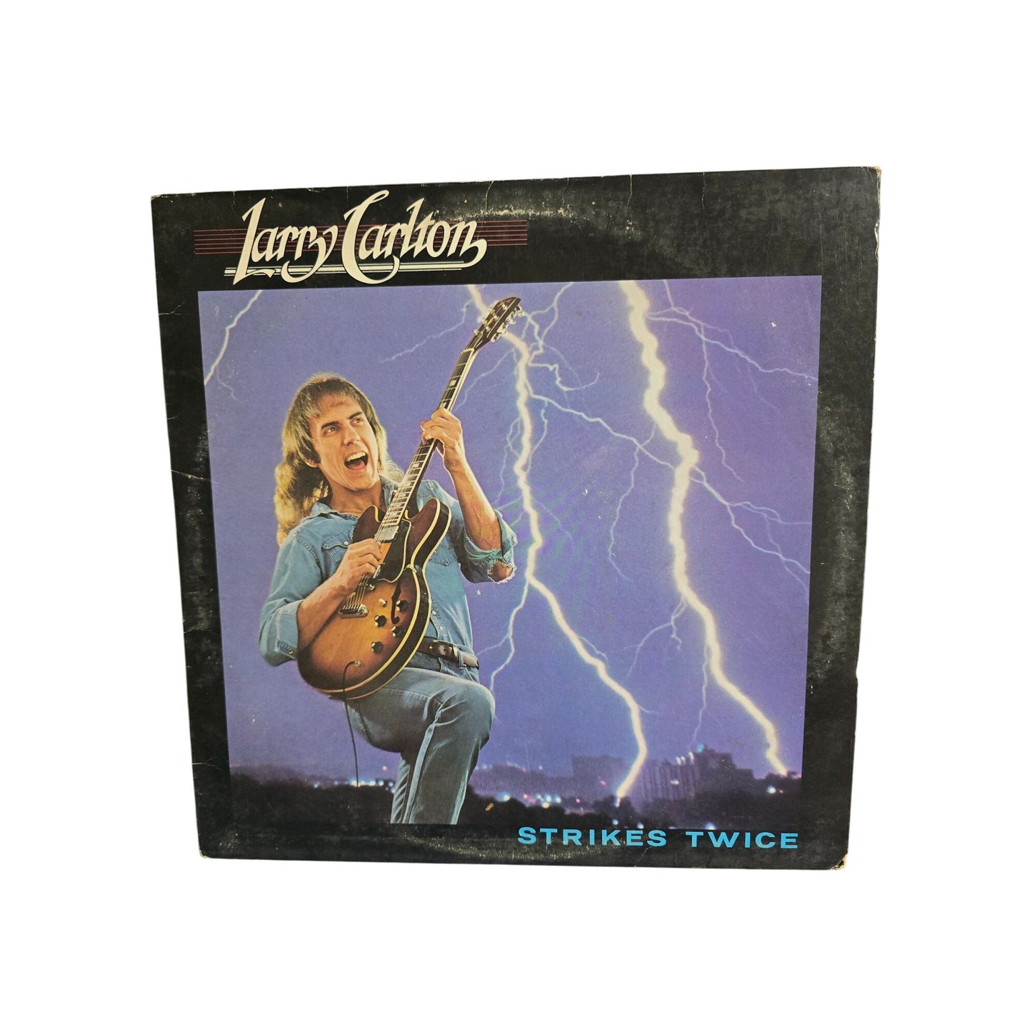 Larry Carlto "Strikes Twice